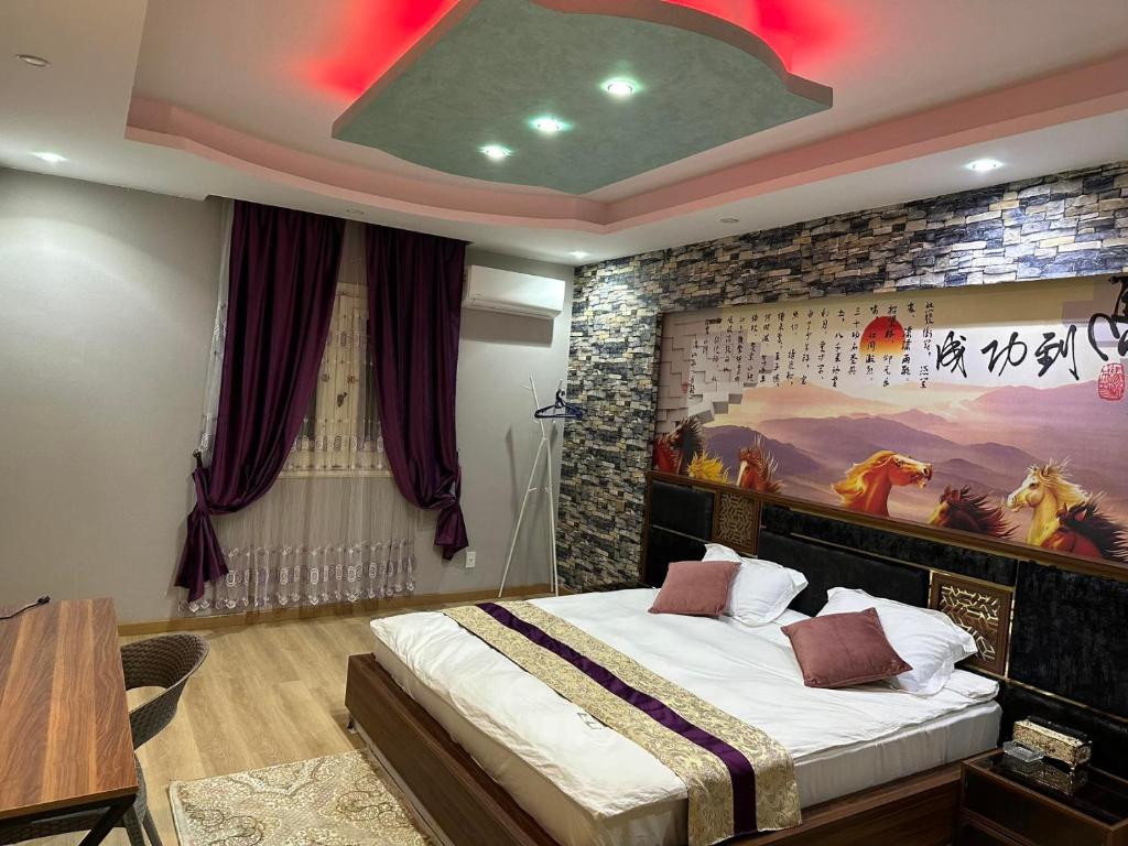 Postel nebo postele na pokoji v ubytování JubingeHotel 聚滨阁民宿