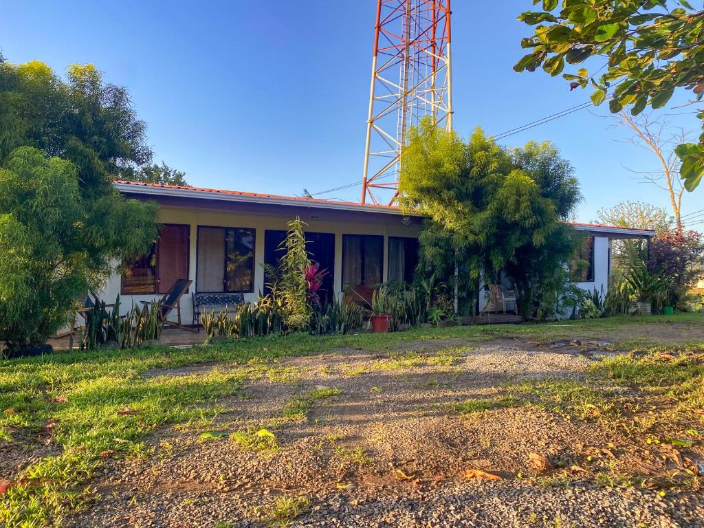 a house with a tower on top of it at Hospedaje Shaddai in Palo