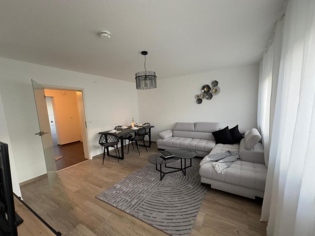 a living room with a couch and a table at Rose in Rosenfeld