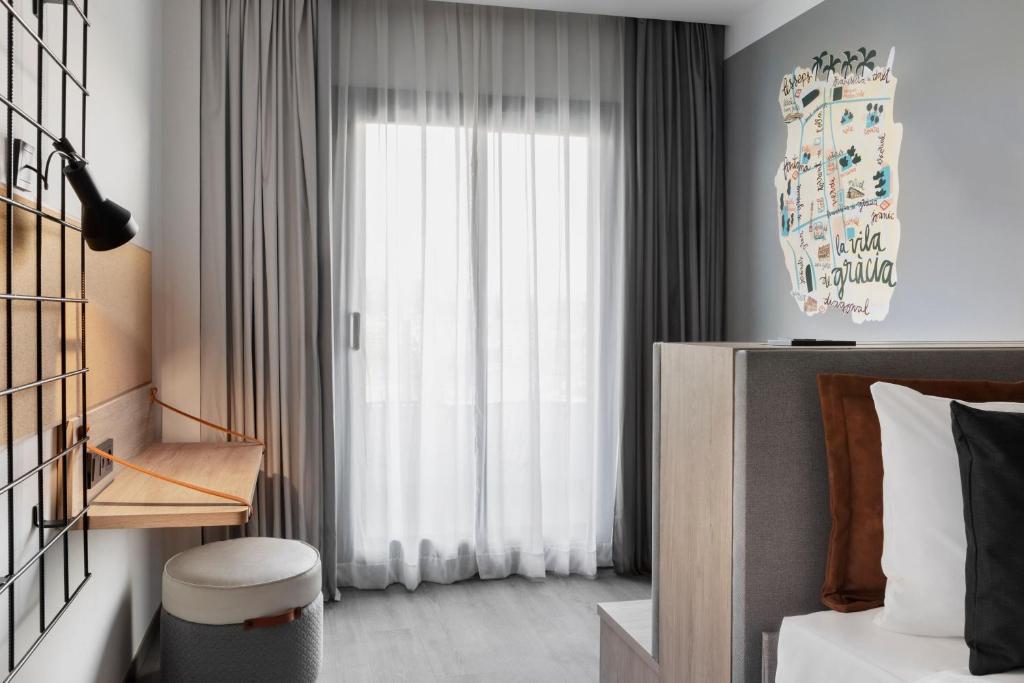 Posteľ alebo postele v izbe v ubytovaní Moxy Barcelona