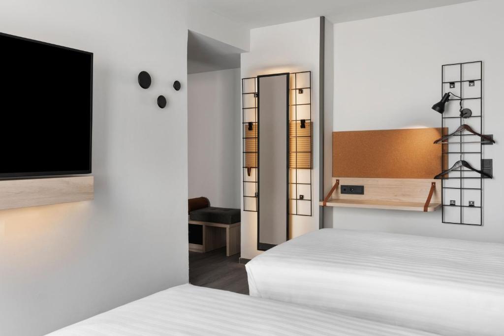 Posteľ alebo postele v izbe v ubytovaní Moxy Barcelona