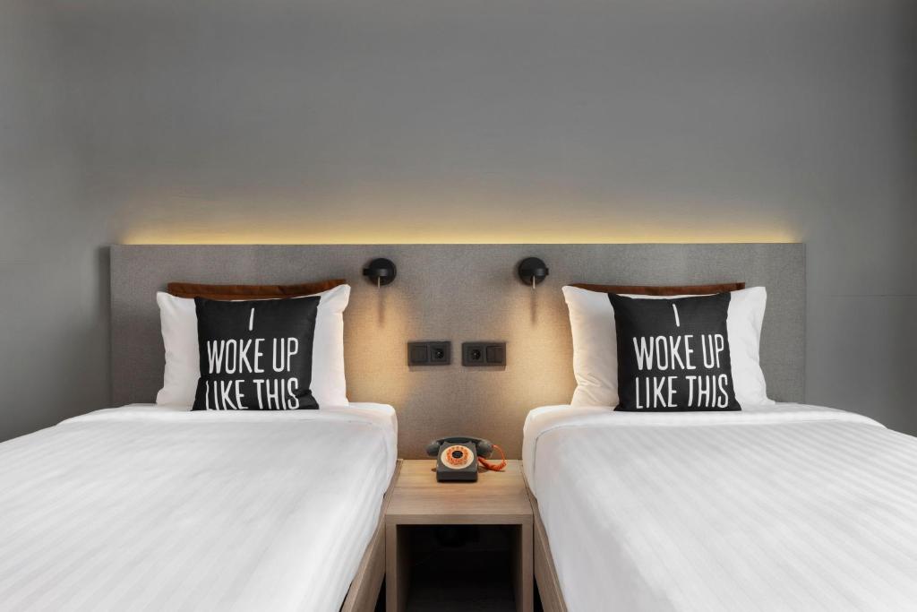 Posteľ alebo postele v izbe v ubytovaní Moxy Barcelona