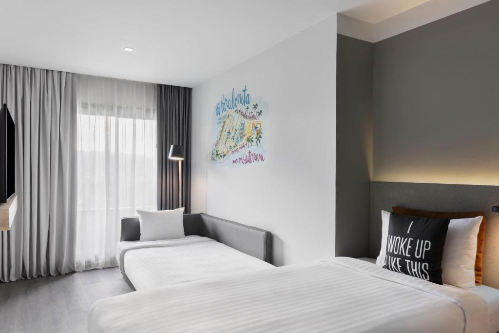 Posteľ alebo postele v izbe v ubytovaní Moxy Barcelona