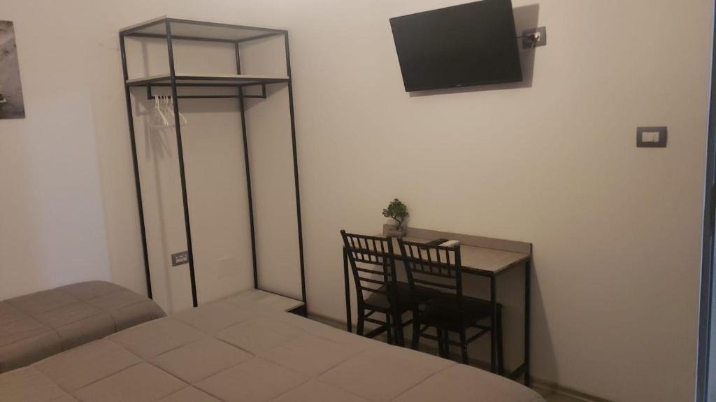 TV a/nebo společenská místnost v ubytování Hotel Antigone