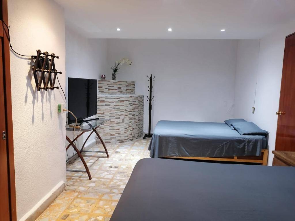 Кровать или кровати в номере Amplio departamento