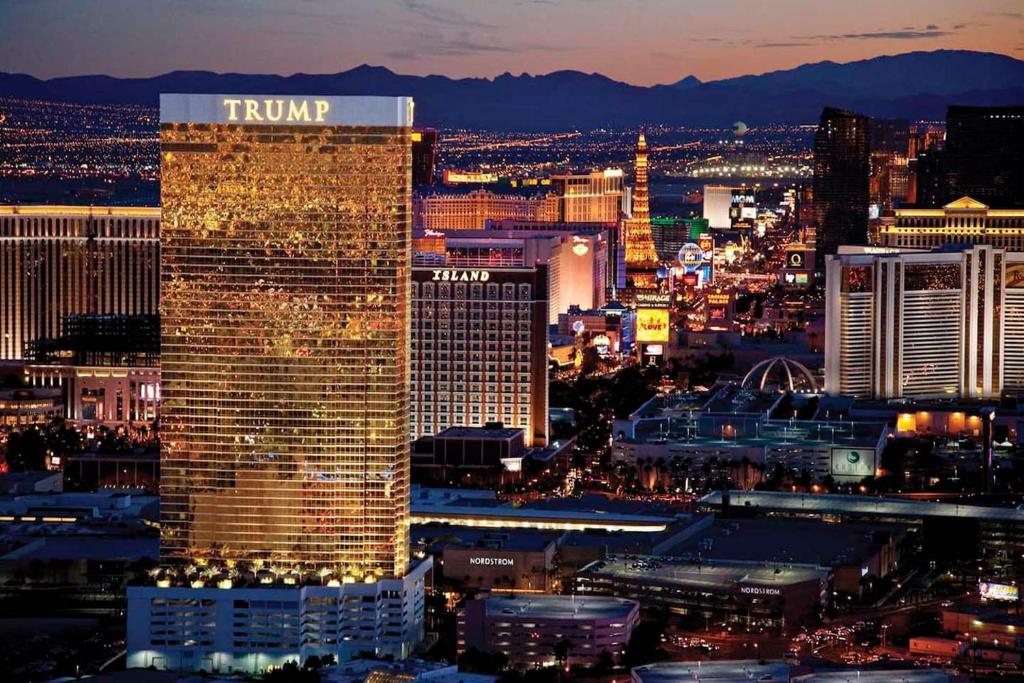 a view of the trump hotel and casino at night at Five Star Trump Hotel No Resort And Cleaning Fees in Las Vegas
