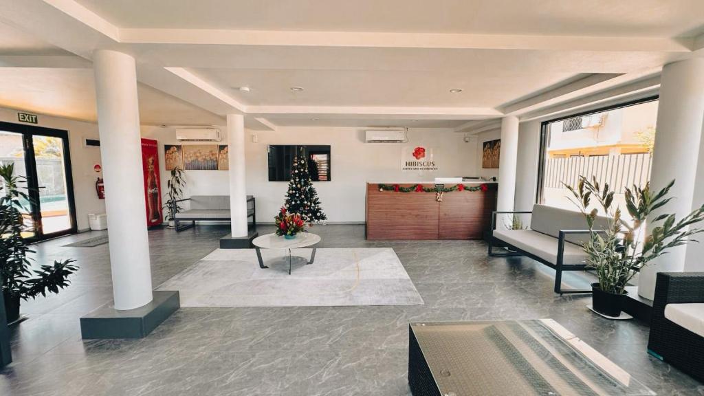 TV o dispositivi per l'intrattenimento presso Hibiscus Suites And Residences