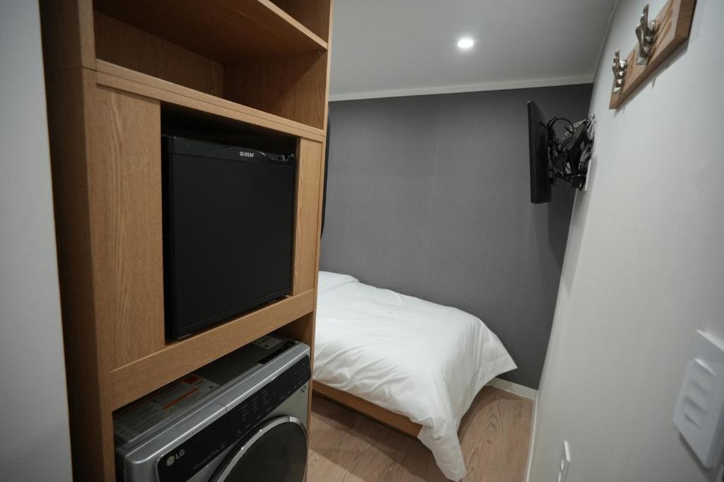 Postel nebo postele na pokoji v ubytování About Stay Dongdaemun