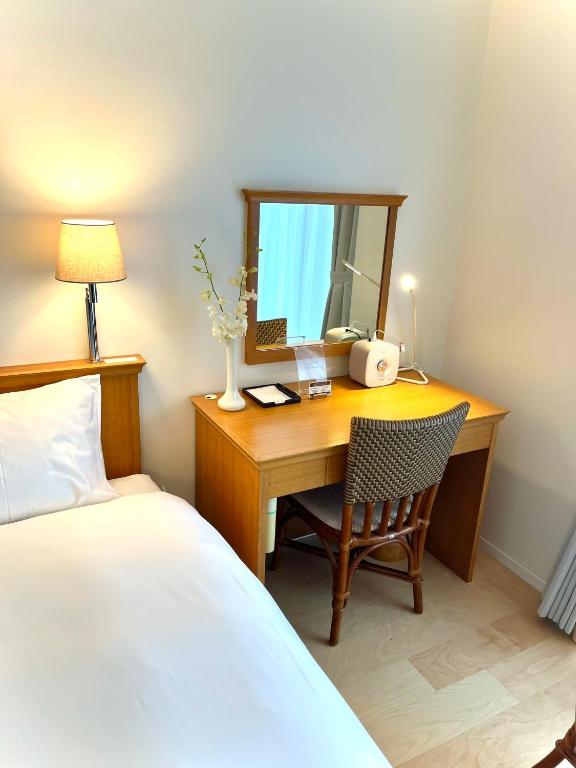 Postel nebo postele na pokoji v ubytování Karuizawa Tennku Hotel & Resort