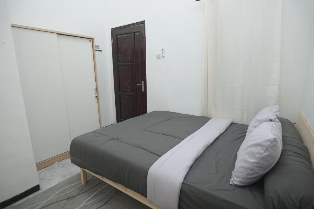 Postel nebo postele na pokoji v ubytování Casa de Vie Homestay