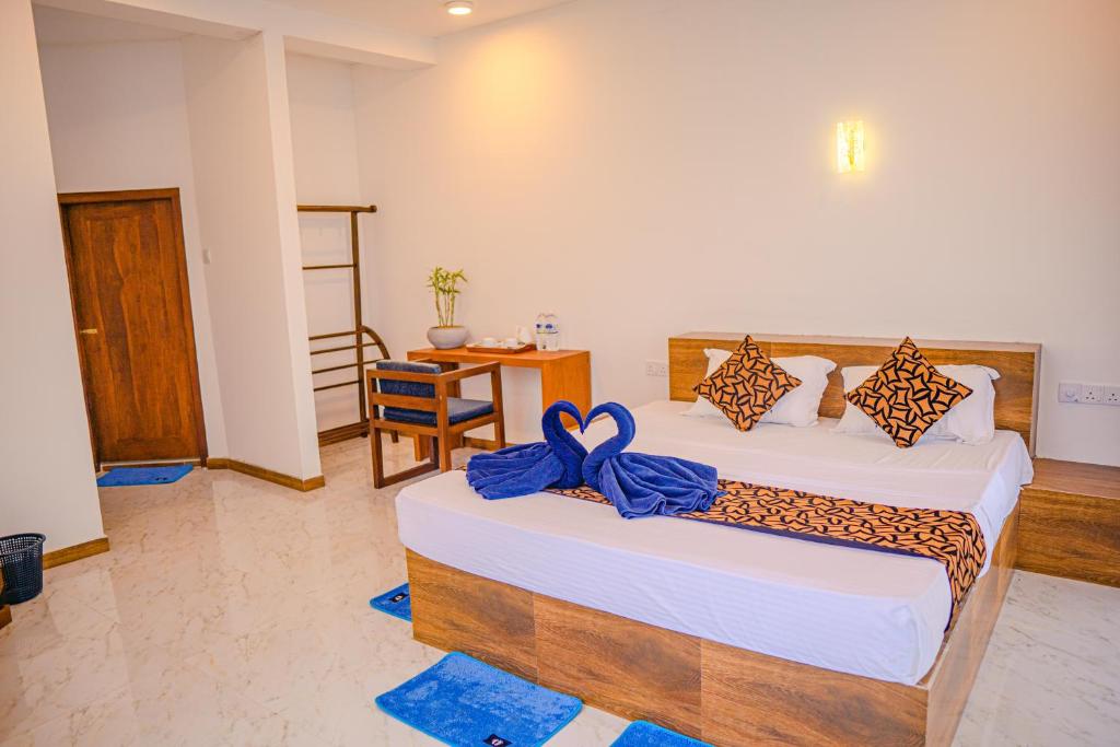 Ένα ή περισσότερα κρεβάτια σε δωμάτιο στο Cool Beach Hotel