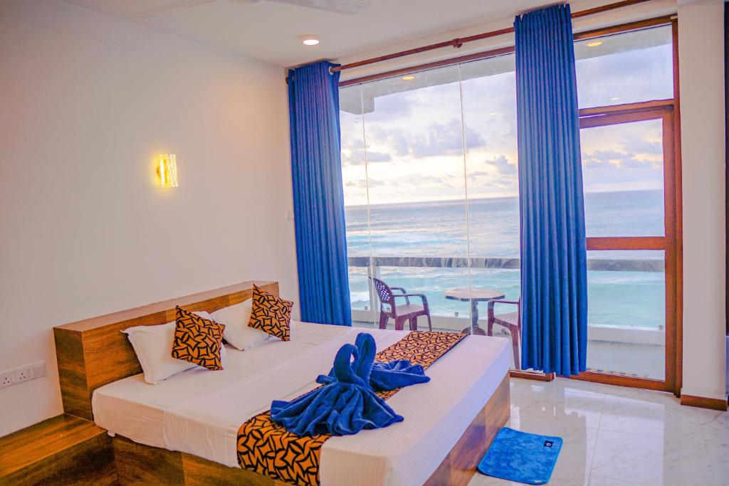 Ένα ή περισσότερα κρεβάτια σε δωμάτιο στο Cool Beach Hotel
