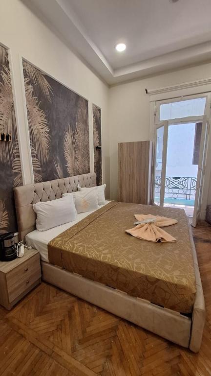 Postel nebo postele na pokoji v ubytování downtown Family Suites