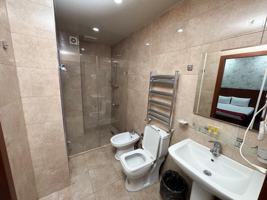 Koupelna v ubytování Consul Hotel