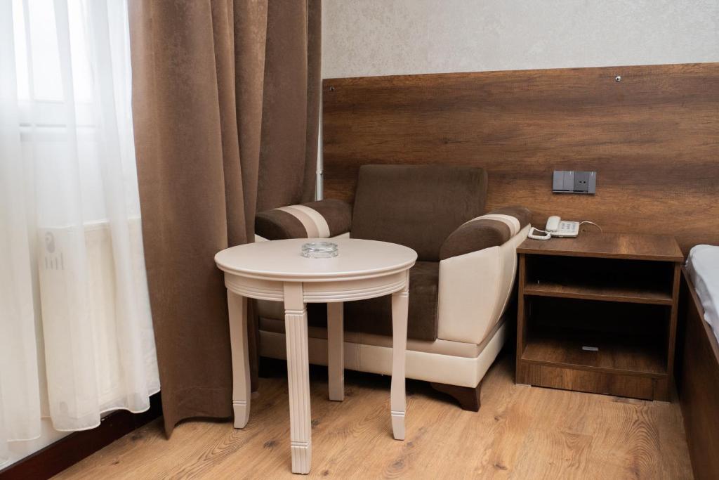 Postel nebo postele na pokoji v ubytování Consul Hotel