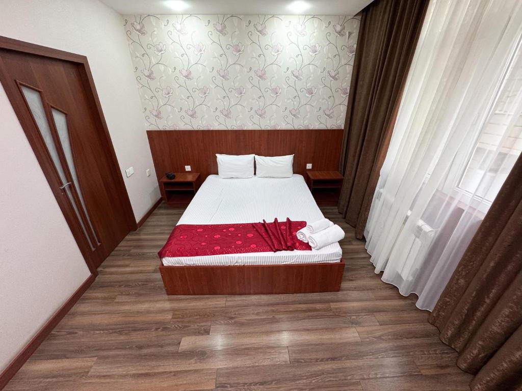 Postel nebo postele na pokoji v ubytování Consul Hotel