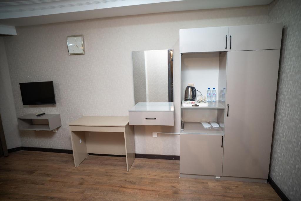Kuchyň nebo kuchyňský kout v ubytování Consul Hotel
