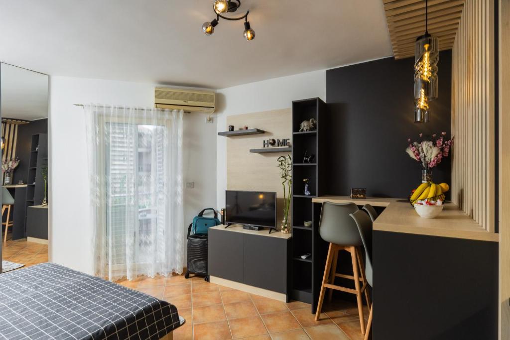 Ліжко або ліжка в номері Adzic Apartments