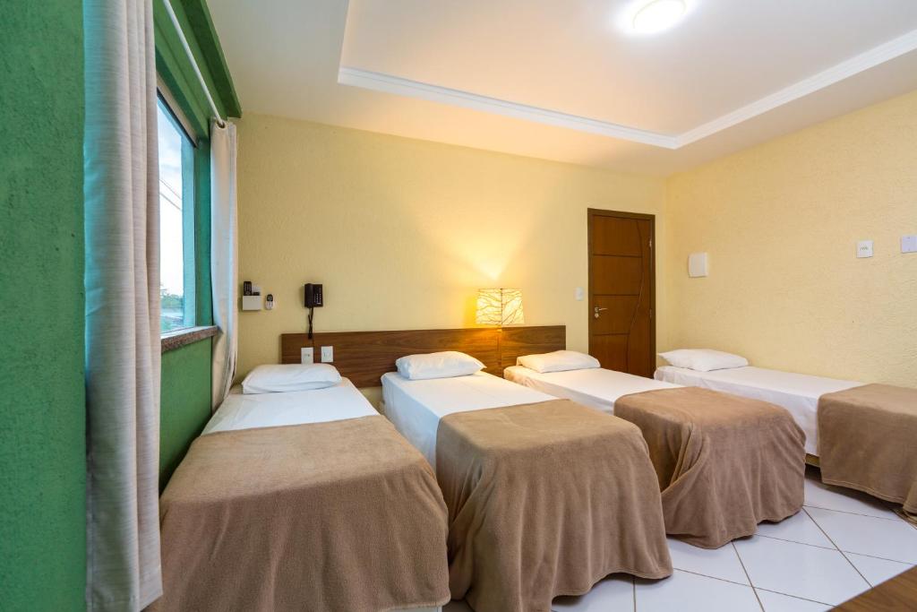 Postel nebo postele na pokoji v ubytování Hotel Imperial