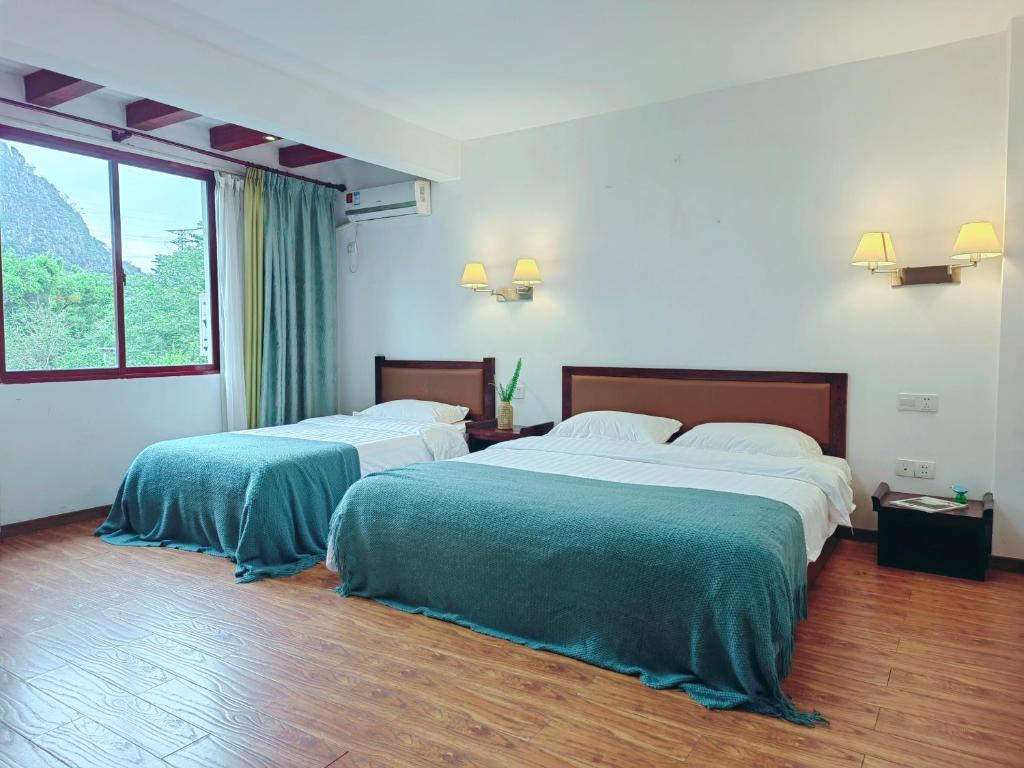 Giường trong phòng chung tại Castle peak yard Inn Guilin-Free one-way pick-up service for high-speed rail