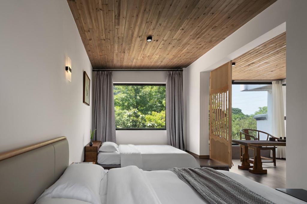 Giường trong phòng chung tại Castle peak yard Inn Guilin-Free one-way pick-up service for high-speed rail