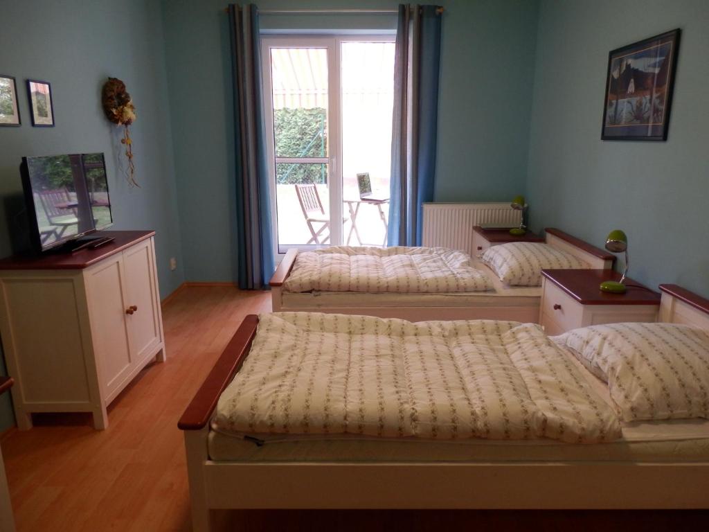 Postel nebo postele na pokoji v ubytování Ubytování U lázní Aurora