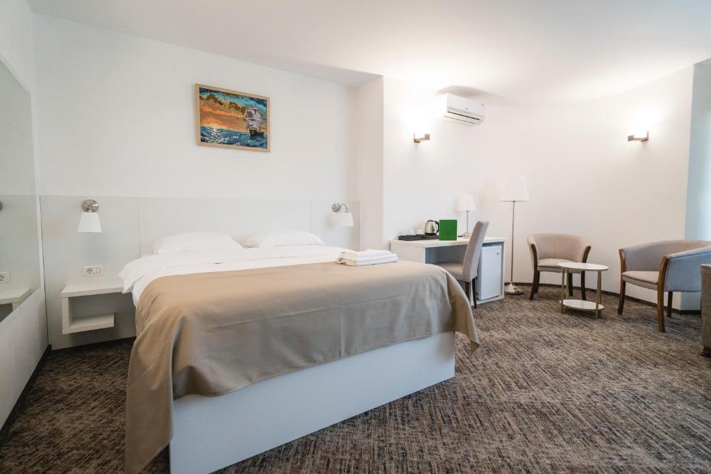 Postel nebo postele na pokoji v ubytování Hotel Comat Deva