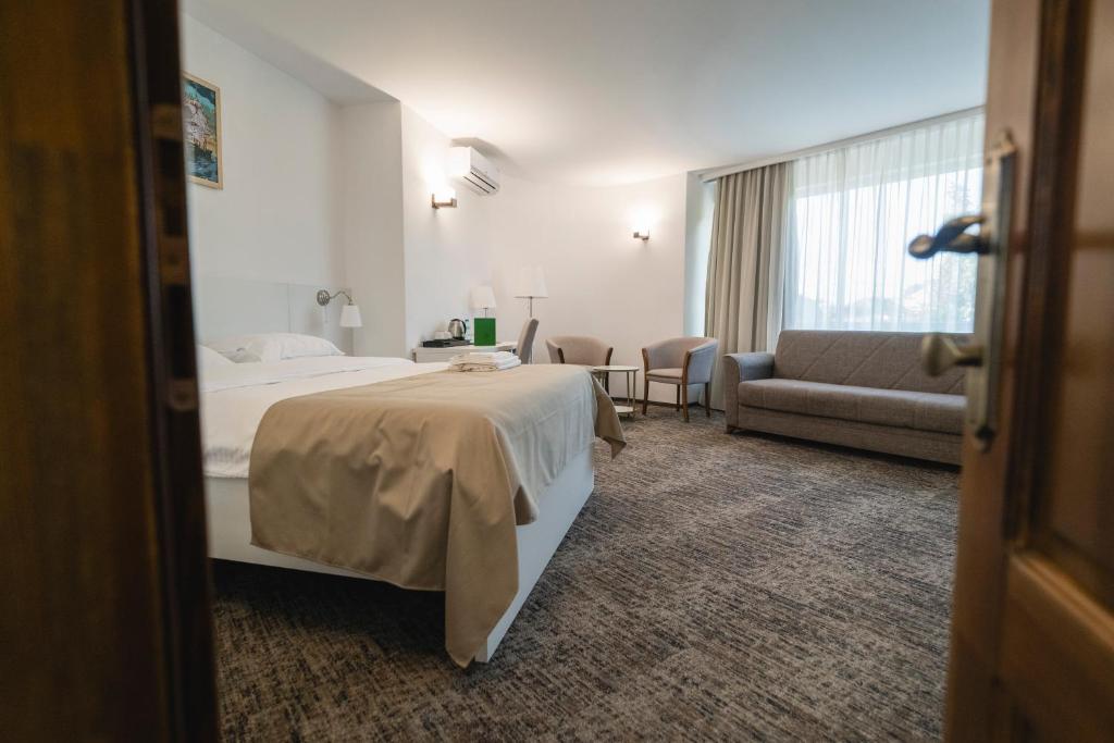 Postel nebo postele na pokoji v ubytování Hotel Comat Deva