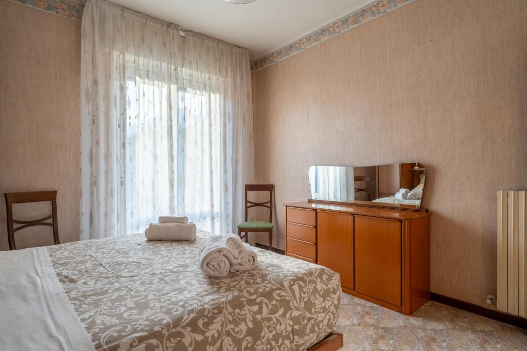 Postel nebo postele na pokoji v ubytování Garden - residence in the center of Barzio