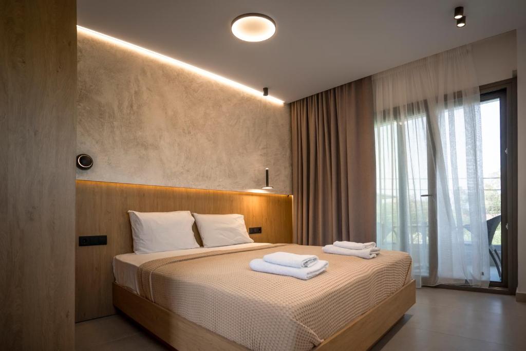 Posteľ alebo postele v izbe v ubytovaní Dionisos Resort