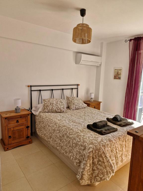 A bed or beds in a room at Apartamento Canal, a 3 minutos de la Playa del Arenal