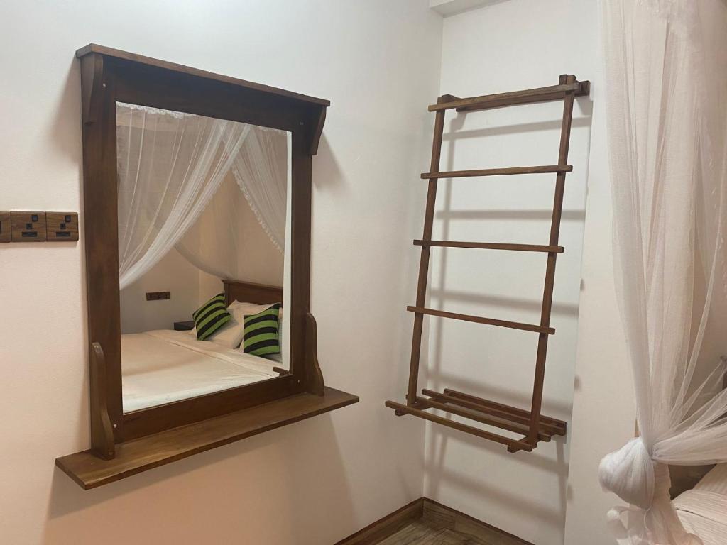 Postel nebo postele na pokoji v ubytování Ella Leafy Homestay