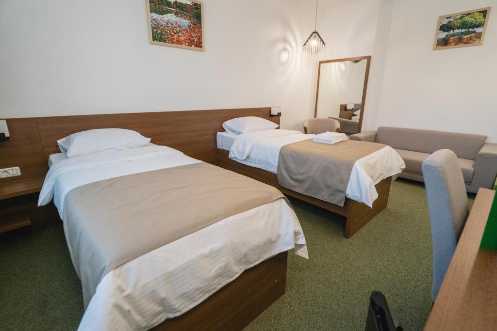 Postel nebo postele na pokoji v ubytování Hotel Comat Deva