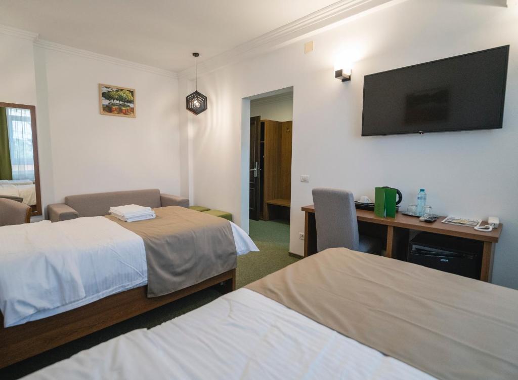 Postel nebo postele na pokoji v ubytování Hotel Comat Deva