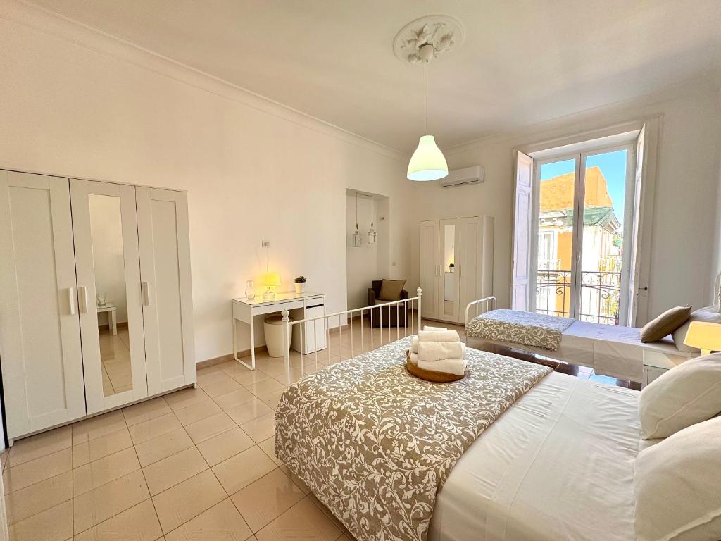 Posteľ alebo postele v izbe v ubytovaní Galasso Apartments