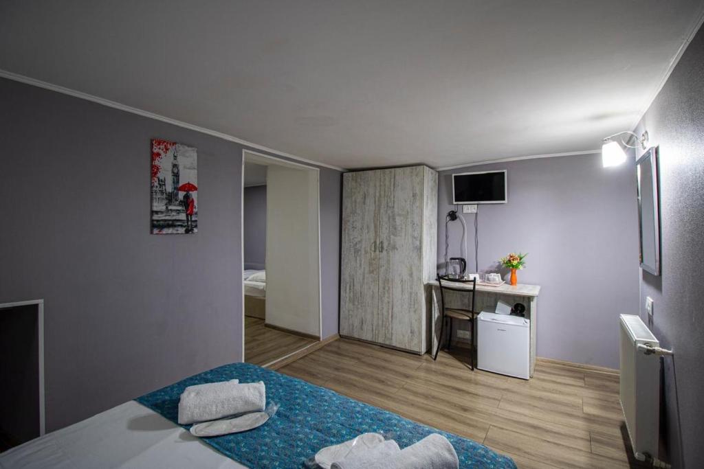 Postel nebo postele na pokoji v ubytování HotelHarmony