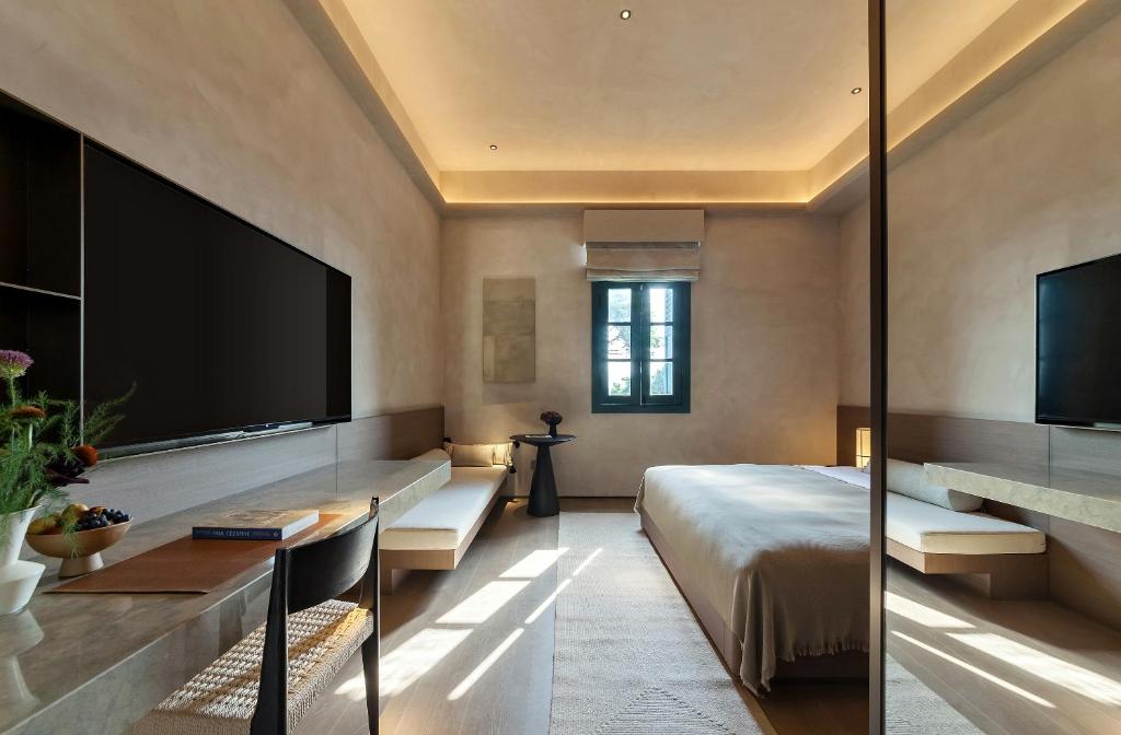 Postel nebo postele na pokoji v ubytování Linggan Anyu Hotel