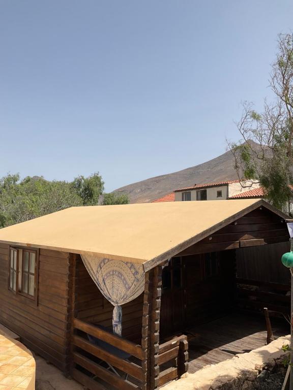 a building with a tan roof on top of it at Not Open in Tindaya