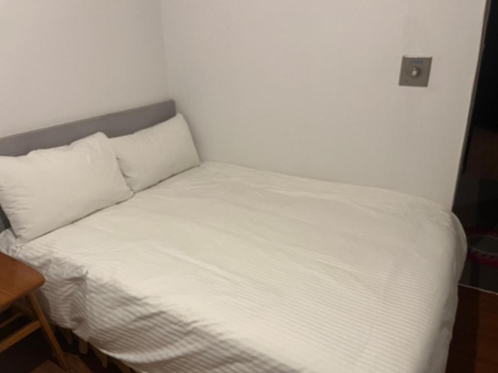 Postel nebo postele na pokoji v ubytování 他里霧Ta Li Woo