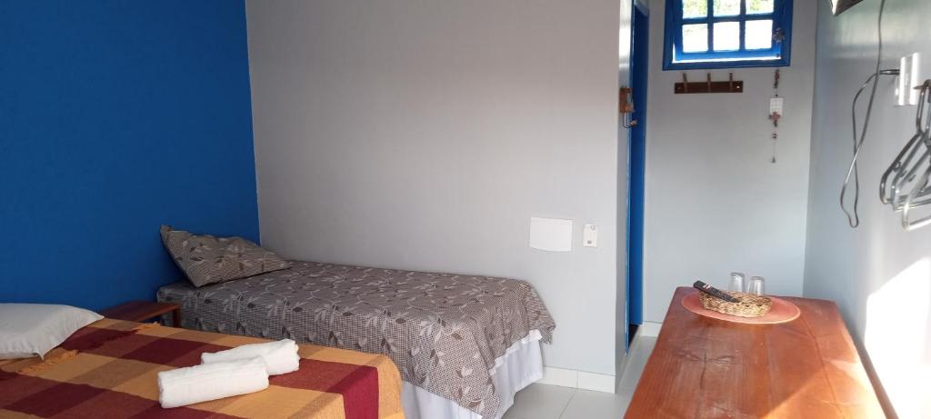 Postel nebo postele na pokoji v ubytování Pousada Rainha do Mar