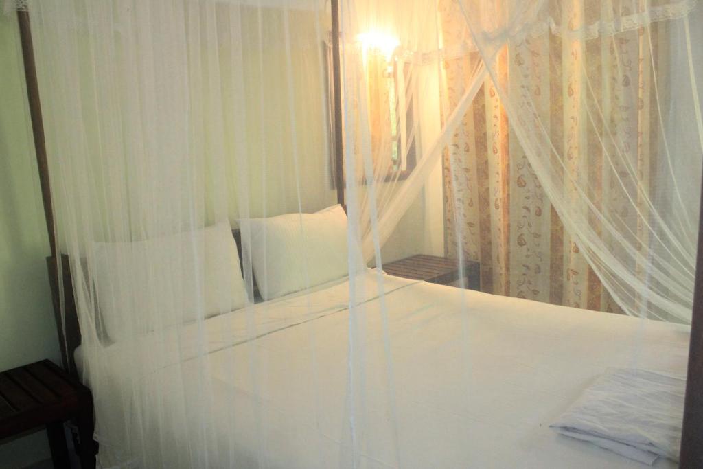 Postel nebo postele na pokoji v ubytování Sigiriya Nature View home Stay