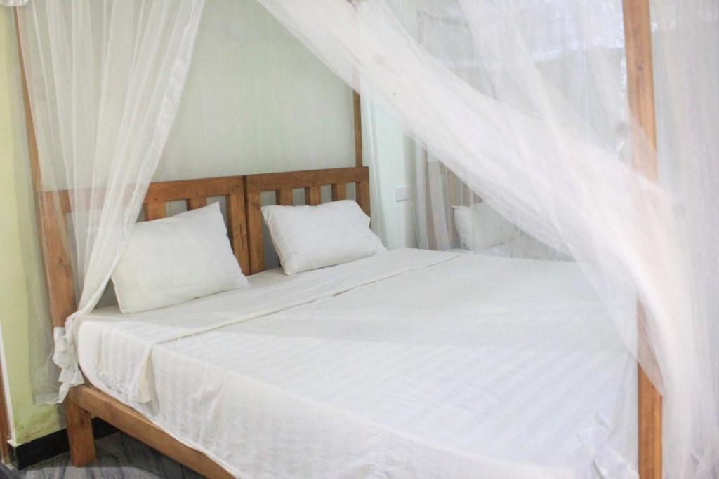 Postel nebo postele na pokoji v ubytování Sigiriya Nature View home Stay