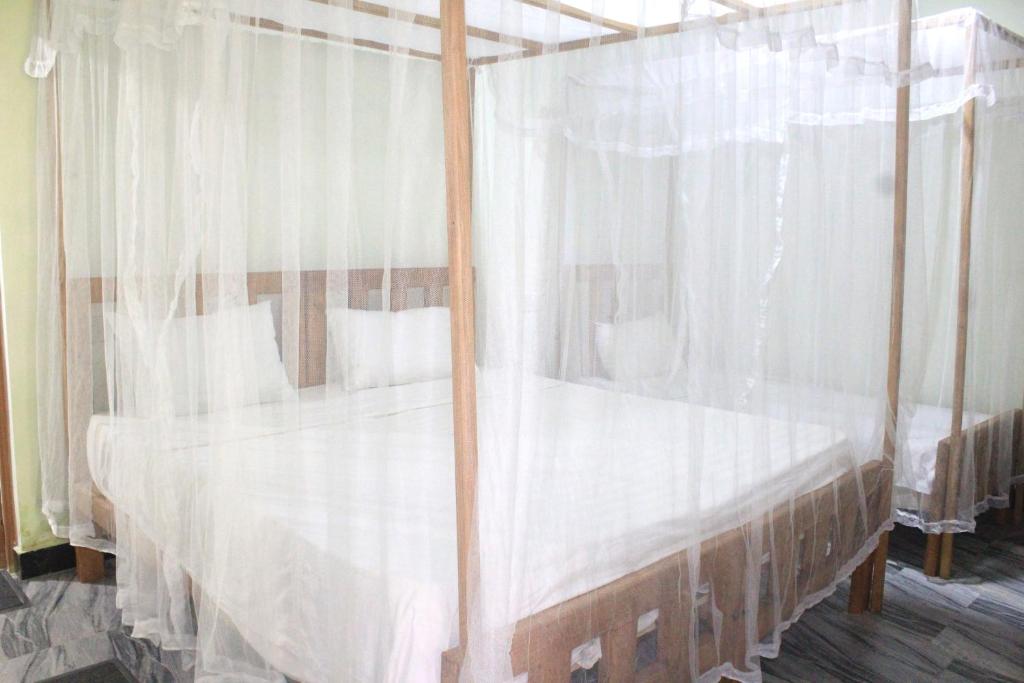 Postel nebo postele na pokoji v ubytování Sigiriya Nature View home Stay