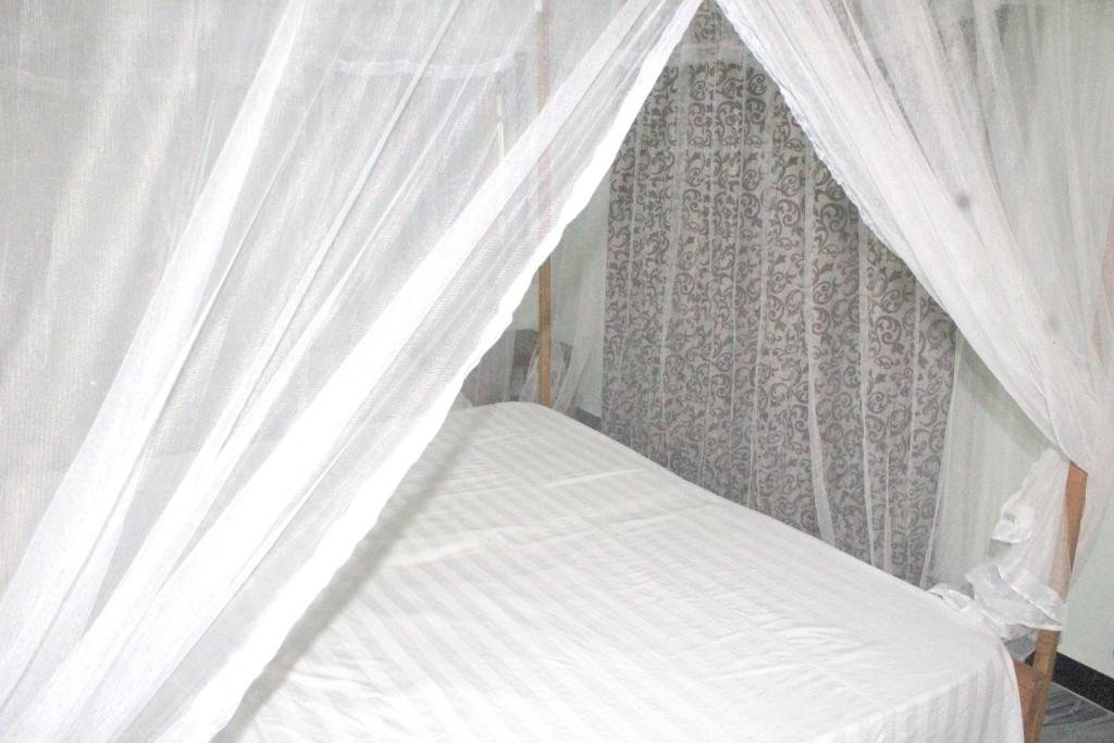 Postel nebo postele na pokoji v ubytování Sigiriya Nature View home Stay