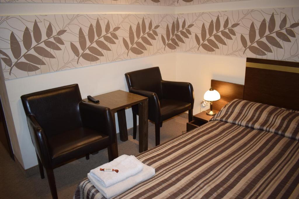 Posteľ alebo postele v izbe v ubytovaní Hotel Orlik