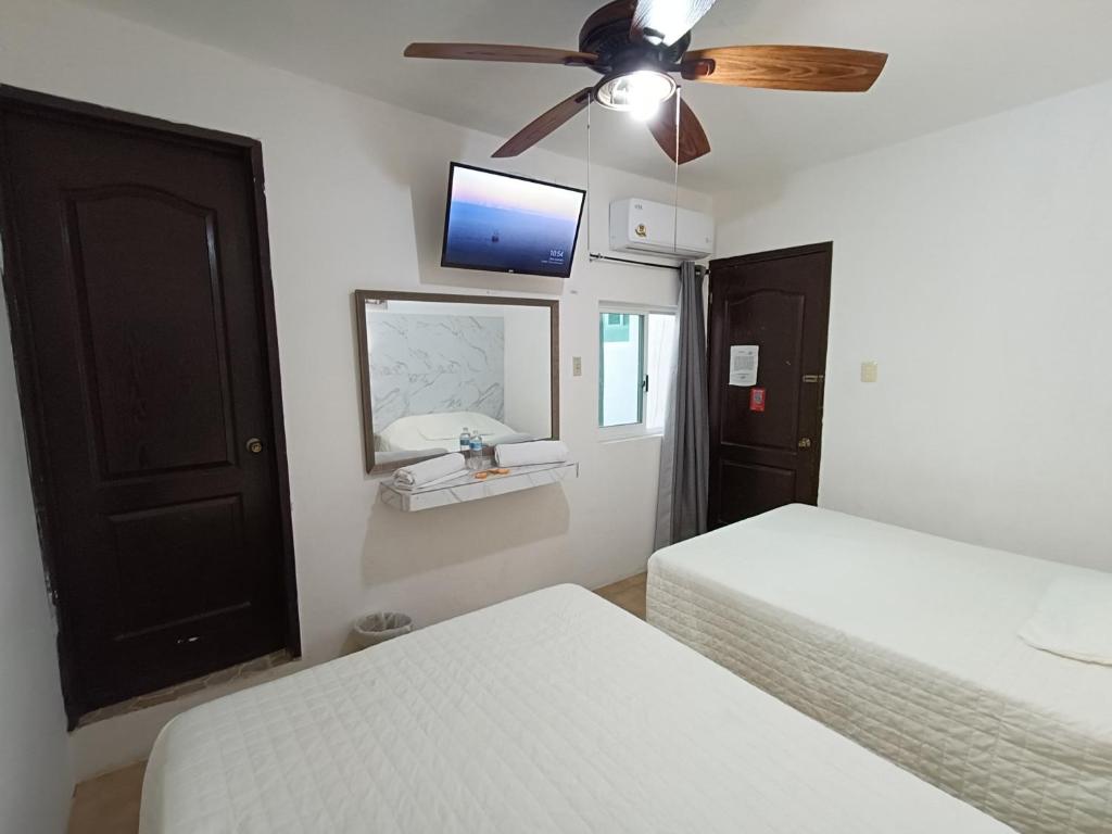 Postel nebo postele na pokoji v ubytování Hotel Rath