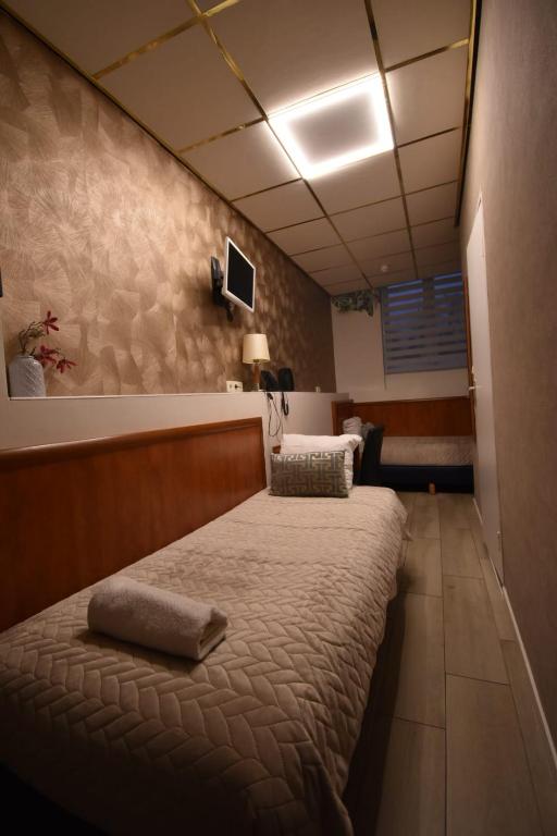 Postel nebo postele na pokoji v ubytování ITC Hotel