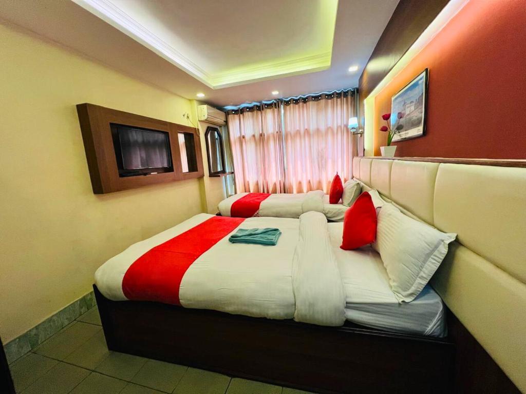Postel nebo postele na pokoji v ubytování Hotel Shraddha Palace