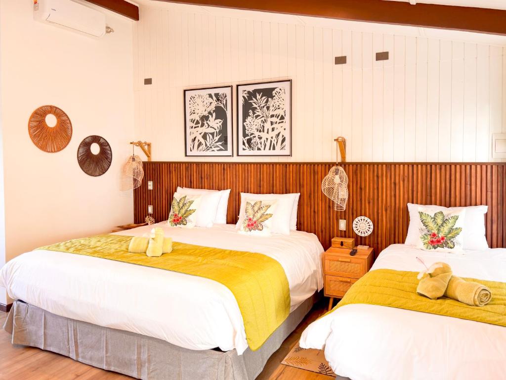 Postel nebo postele na pokoji v ubytování Tahai Loft Apart Hotel