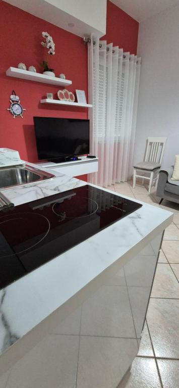 TV a/nebo společenská místnost v ubytování Sunset Apartment